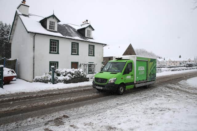 An Asda delivery van driving through snowy conditions in Scotland picture: PA/Andrew Milligan