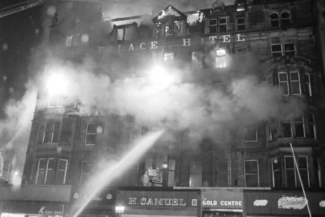 Firemen direct their hoses onto the fron of the Palace Hotel on the corner of Castle in Edinburgh as fire takes hold in June 1991. The Palace was subsequently demolished and replaced by a new building.