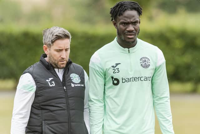 Hibs boss Lee Johnson and striker Elie Youan in training. Picture: SNS