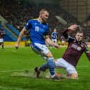 Andy Halliday and St Johnstone's James Brown during Hearts' draw at McDiarmid Park earlier in the season. Picture: SNS