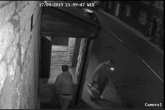 A CCTV still image shows Orman in Kirknewton's Main Street around 9pm.