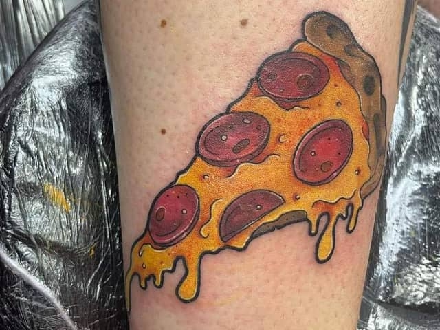Alana Scott shared this amazingly colourful tattoo of a pizza slice.