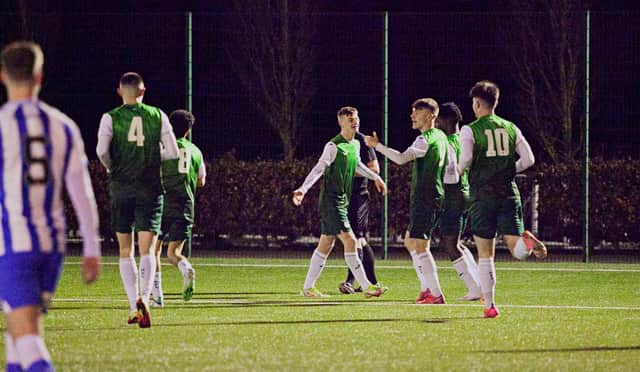 Josh McCulloch, centre, and Josh O'Connor (third right) celebrate as Hibs Under-18s see off Kilmarnock at HTC. Picture: Maurice Dougan
