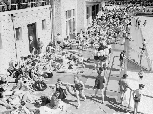 Crowds sunbathing poolside at Portobello Outdoor Swimming Pool in 1955.
