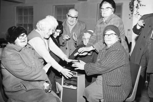 Old people at Dalry House huddling round a single paraffin heater during a power cut.   Picture: Bill Stout.