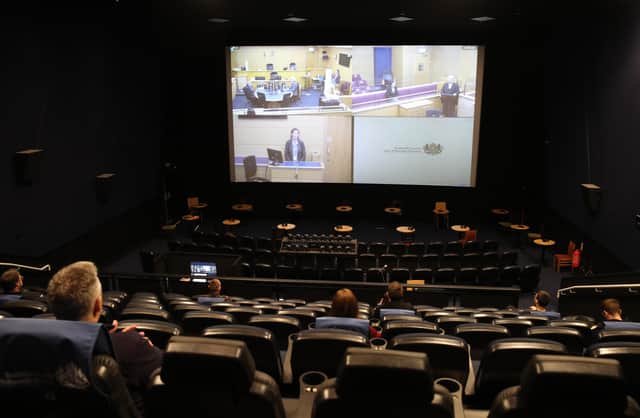 What no popcorn? A mock trial is shown on a screen as people sit in marked seats where a jury would sit in screen number three at the Odeon complex in Edinburgh (Picture: Andrew Milligan/PA)