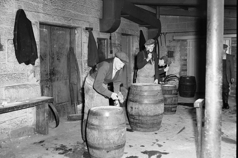 Coopers tighten hasps on barrel of beer at Ushers Brewery, St Leonards, one of the city's once numerous breweries.