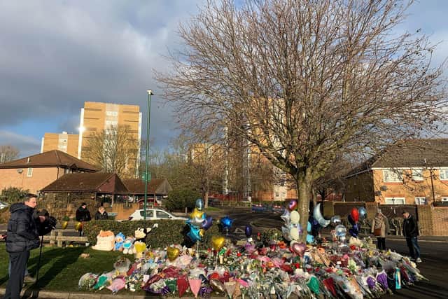 Flowers and tributes lay near the scene in Babbs Mill Park in Kingshurst, Solihull. (Photo credit: Richard Vernalls/PA Wire)