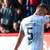 Ryan Porteous makes his way off the pitch at Pittodrie after his sending off