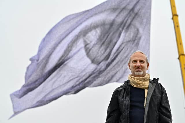 Swiss 'artivist' Dan Acher was in Edinburgh to unveil the climate installation, which is made up of thousands of individual portraits of people from 190 countries across the globe