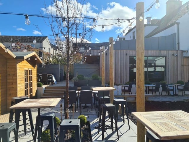 The Balerno Inn is located just outside of Edinburgh, near the stunning Pentland Hills in Balerno. Its beer garden has a children's play area and there's heating blankets, and even outdoor bothies if it gets chilly.