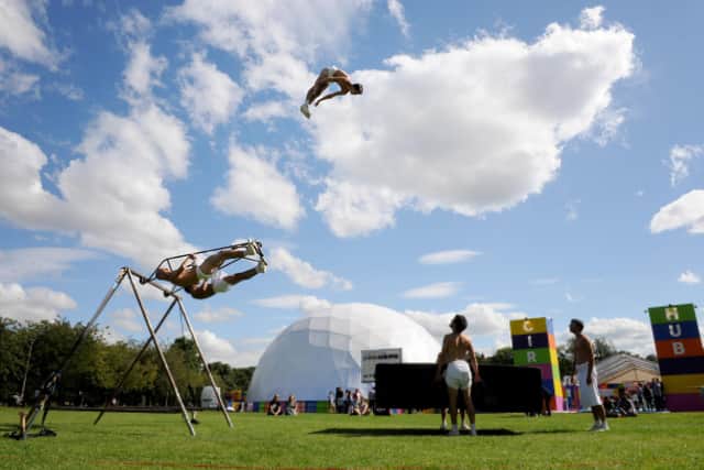 An acrobat from La Meute flies over the Circus Hub, the Fringe venue on the Meadows. Picture: Jane Barlow