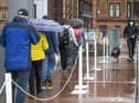 People queue to vote in the Parliamentary election outside the polling station at Notre Dame Primary School in Glasgow. Picture: PA