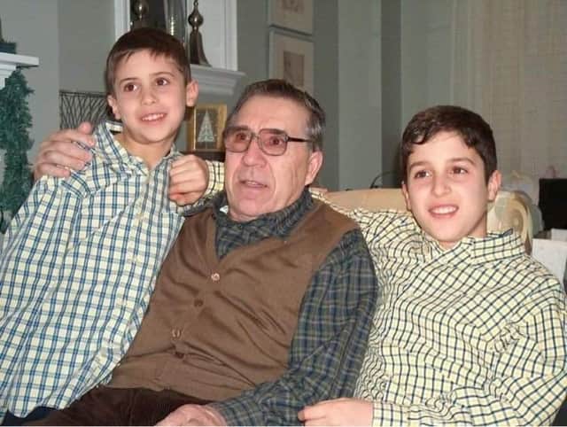 Dina's father with her two sons