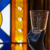 ‘Raising a glass to Robbie Burns’: Ahead of Burn Night on 25 January , Claudia Bolling  - House and Collections Officer at the Abbotsford Trust, holds - Robert Burns' glass tumbler, diamond-point engraved by the poet