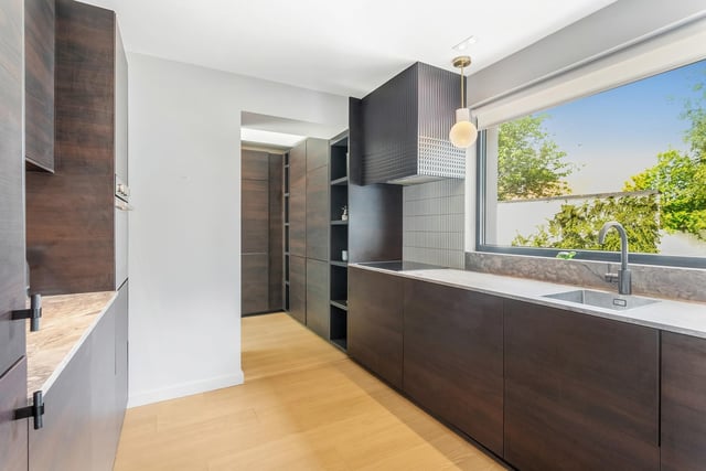 The kitchen has been beautifully designed with plenty of storage.
