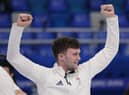 Edinburgh's Bruce Mouat celebrates after winning the men's curling semi-final match against the United States at the Beijing Winter Olympics