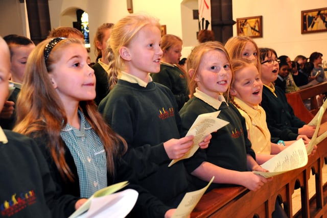 Children from Hudson Road Primary School sing out at a service in St Ignatius Church a decade ago.