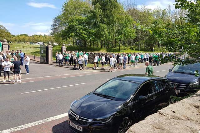 Photos and video footage appear to show large numbers of mourners dressed in Hibs clothing, standing in tight groups.