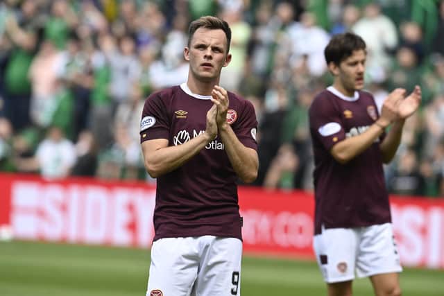 Lawrence Shankland and Peter Haring applaud the Hearts fans. Picture:n Rob Casey / SNS