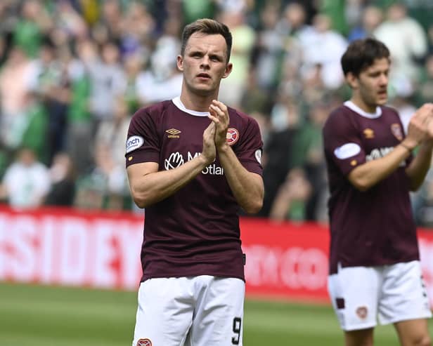 Lawrence Shankland and Peter Haring applaud the Hearts fans. Picture:n Rob Casey / SNS