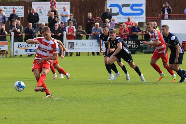 Neil Martynuik slots home the decisive penalty for Bonnyrigg Rose to move the Midlothian men up to second in the table. Picture: Joe Gilhooley LRPS