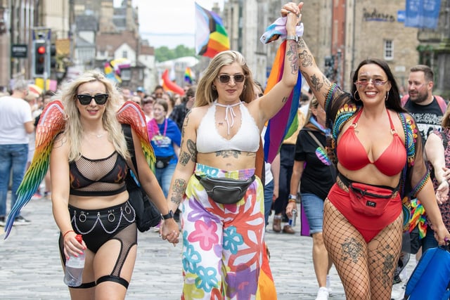 People holding hands as march through Capital for Pride 2023. Photo: Lesley Martin/PA Wire