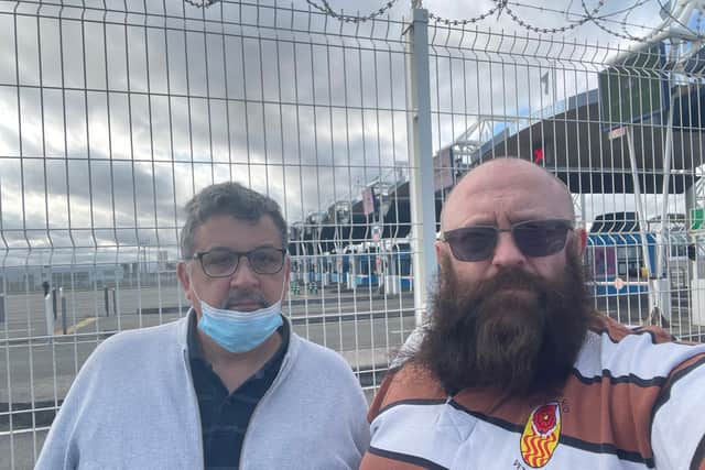 (L - R) Business partners Ricardo Rivero and Craig Douglas at the Calais ferry after being refused entry.