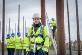 An Openreach trainer with apprentices in a pole yard. Pic: Monty Rakusen