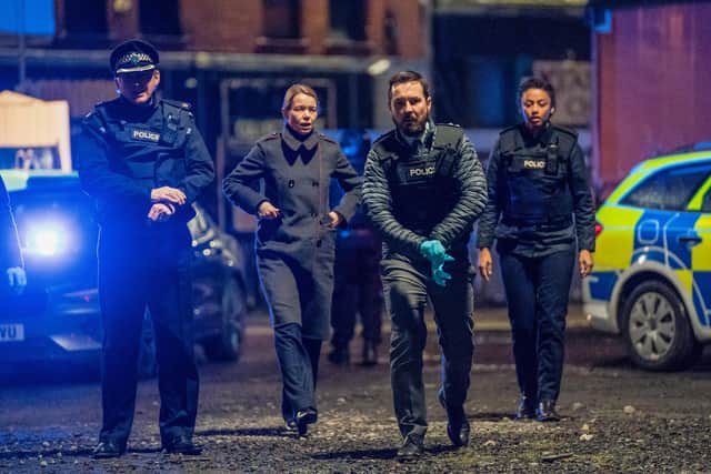 Martin Compston as Steve Arnott leads the charge at the scene of the Fleming-Pilkington shootout