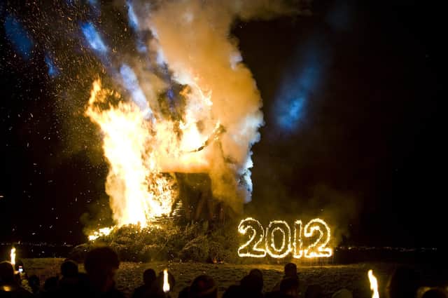 The end of the torchlight procession fire on Calton Hill. Part of the New Year Hogmanay 2012 celebrations. 
Photo by Ian Georgeson.