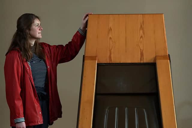 Georgia Vullinghs, Assistant Curator of Modern and Contemporary History, at the National Museum of Scotland, alongside the "Speaker's Chair" at the old Royal High School building on Calton Hill.  Picture: Stewart Attwood