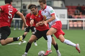Spartans James Craigen just gets his toe to the ball. Picture: Mark Brown