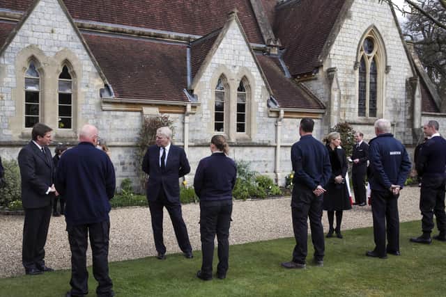 Britain's Prince Andrew, third left, and Sophie, Countess of Wessex talk with Crown Estate staff as they attend the Sunday service at the Royal Chapel of All Saints at Royal Lodge, Windsor.