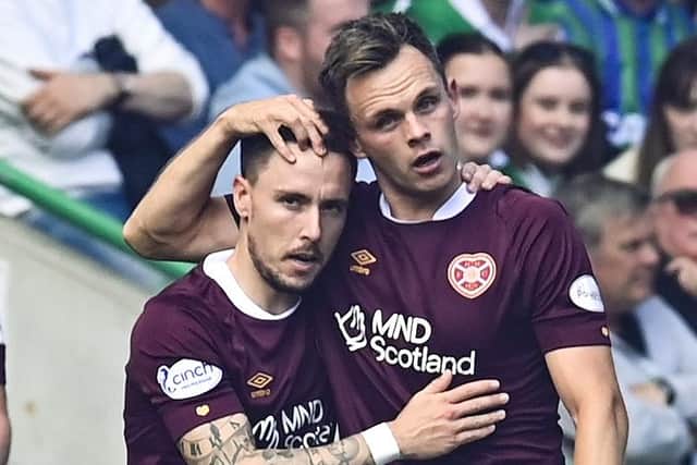 Lawrence Shankland celebrates with Barrie McKay after the latter provided an assist for the opening goal in the Edinburgh derby. Picture: SNS