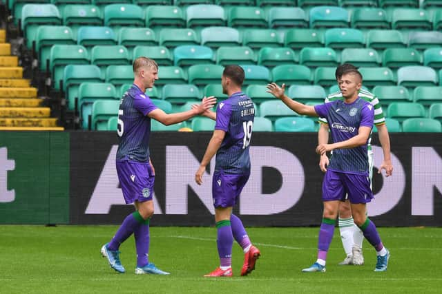 Hibs players celebrate after Josh Doig put the team ahead against Celtic. Picture: SNS