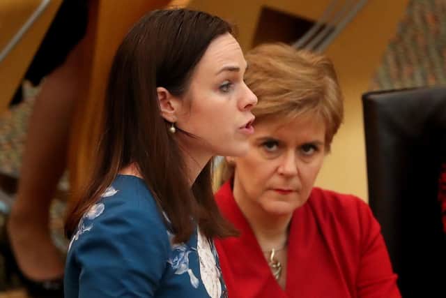 Finance Secretary Kate Forbes, seen with watched by Nicola Sturgeon, has offered councils money if they will agree to freeze council tax (Picture: Andrew Milligan/PA)