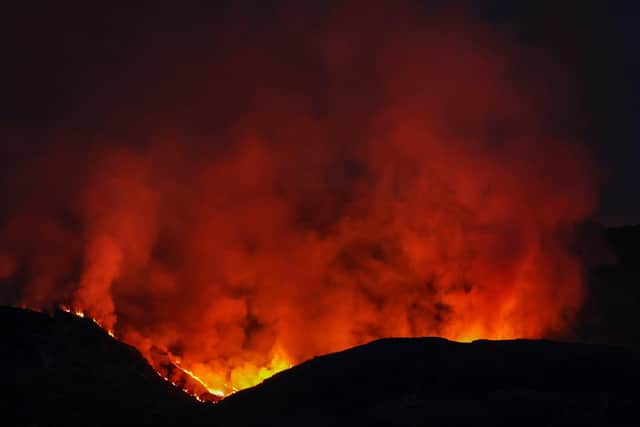 A wild fire burns on the Isle of Bute on April 10 in Colintraive on the Isle of Bute (Photo by Jeff J Mitchell/Getty Images)