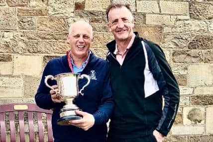 Edinburgh Summer League official Bill Buchan, right, presented the trophy to Craigielaw team manager Rodney French on behalf of league sponsor Dean Ballingall from Rowanbank.