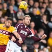 Motherwell's Jake Carroll and Nathaniel Atkinson challenge for the ball in the air at Fir Park