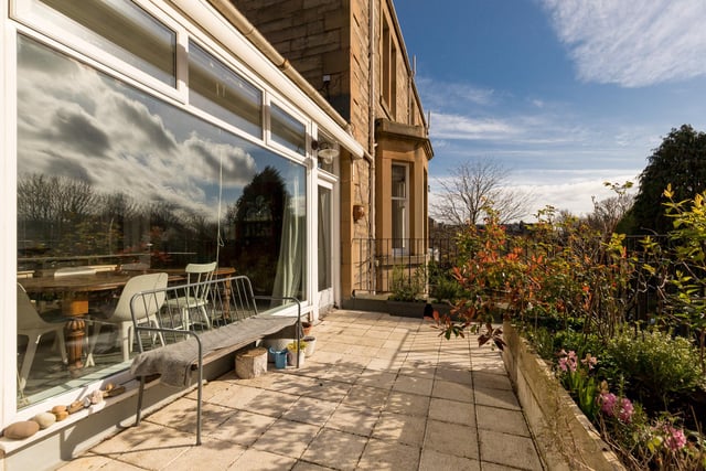 There is a private, suntrap terrace located immediately off the kitchen in this four bedroom flat, offering the perfect spot to soak up any sunshine that hits Edinburgh.