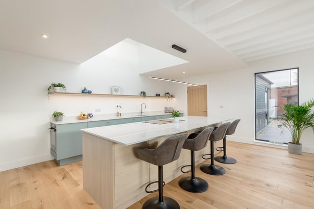 The large 'Forever Spaces' designed kitchen with Silestone Quartz worktop, Neff appliances and Quooker tap.