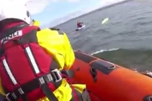 Screenshot of the Kinghorn RNLI rescue of a kayaker and paddleboarder at Portobello Beach.