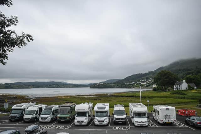 Campervans are seen parked up in Portree, Scotland. Photo: Peter Summers/Getty Images