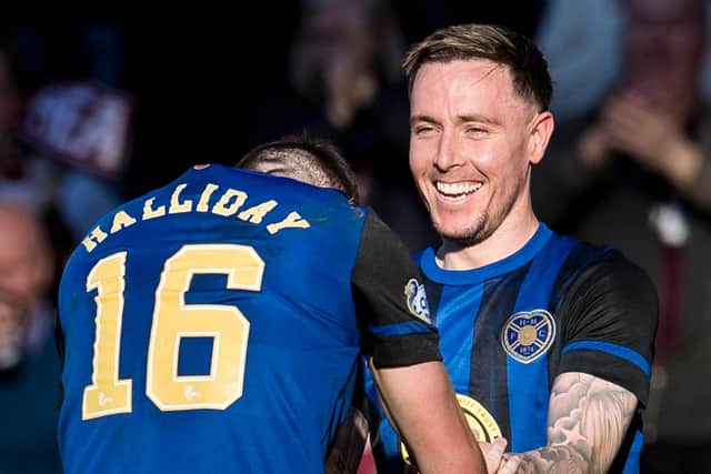 Andy Halliday celebrates with Barrie McKay after the winger's first Hearts goal.