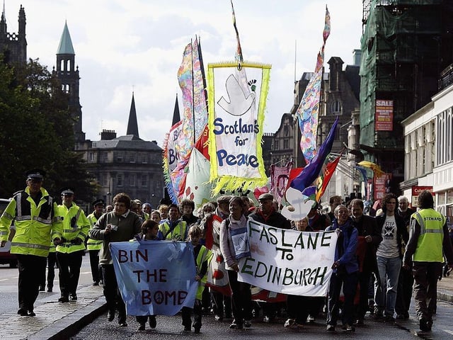 Anti-nuclear demonstrators march through Princes Street in Edinburgh to finish off their 85 mile walk from Faslane submarine base on the Clyde to the Scottish Parliament on 19 September 2006. The campaigners called for an end to Trident missiles and any proposed replacements.