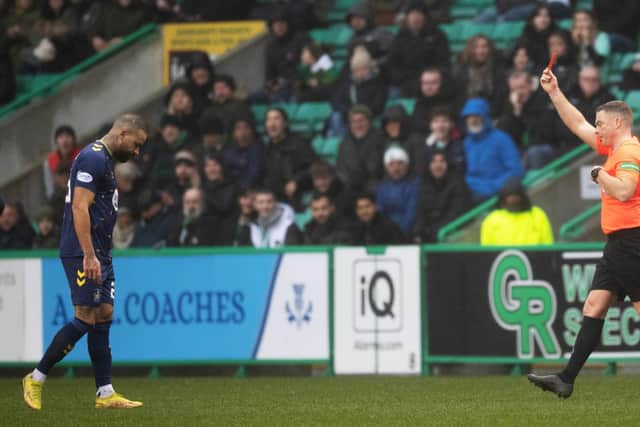 Kyle Vassell is shown a red card by Referee John Beaton at Easter Road on Saturday. Picture: Ross Parker / SNS