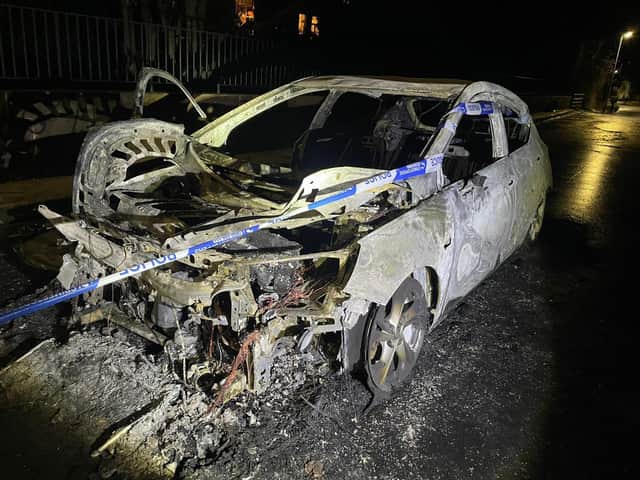 A passer-by took this photograph of the burn-out car on the Roseburn viaduct on Tuesday evening.