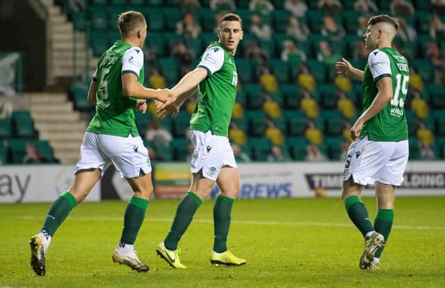 Paul Hanlon, centre, is pleased that Ryan Porteous, left, is on international duty and reckons Kevin Nisbet, right, could be next.