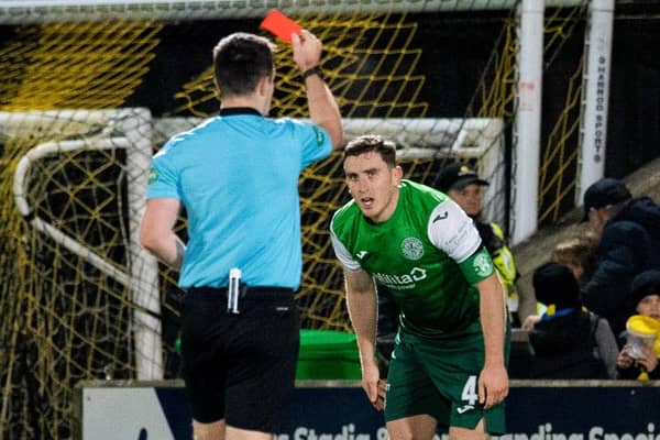 Hibernian's Paul Hanlon is sent off by referee Don Robertson after a second yellow card